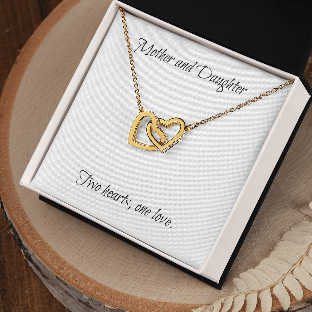 Mother and Daughter connecting hearts necklace.