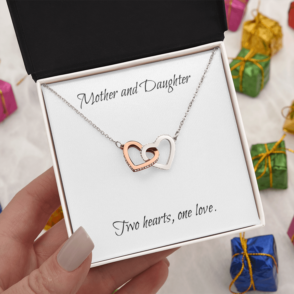 Mother and Daughter connecting hearts necklace.