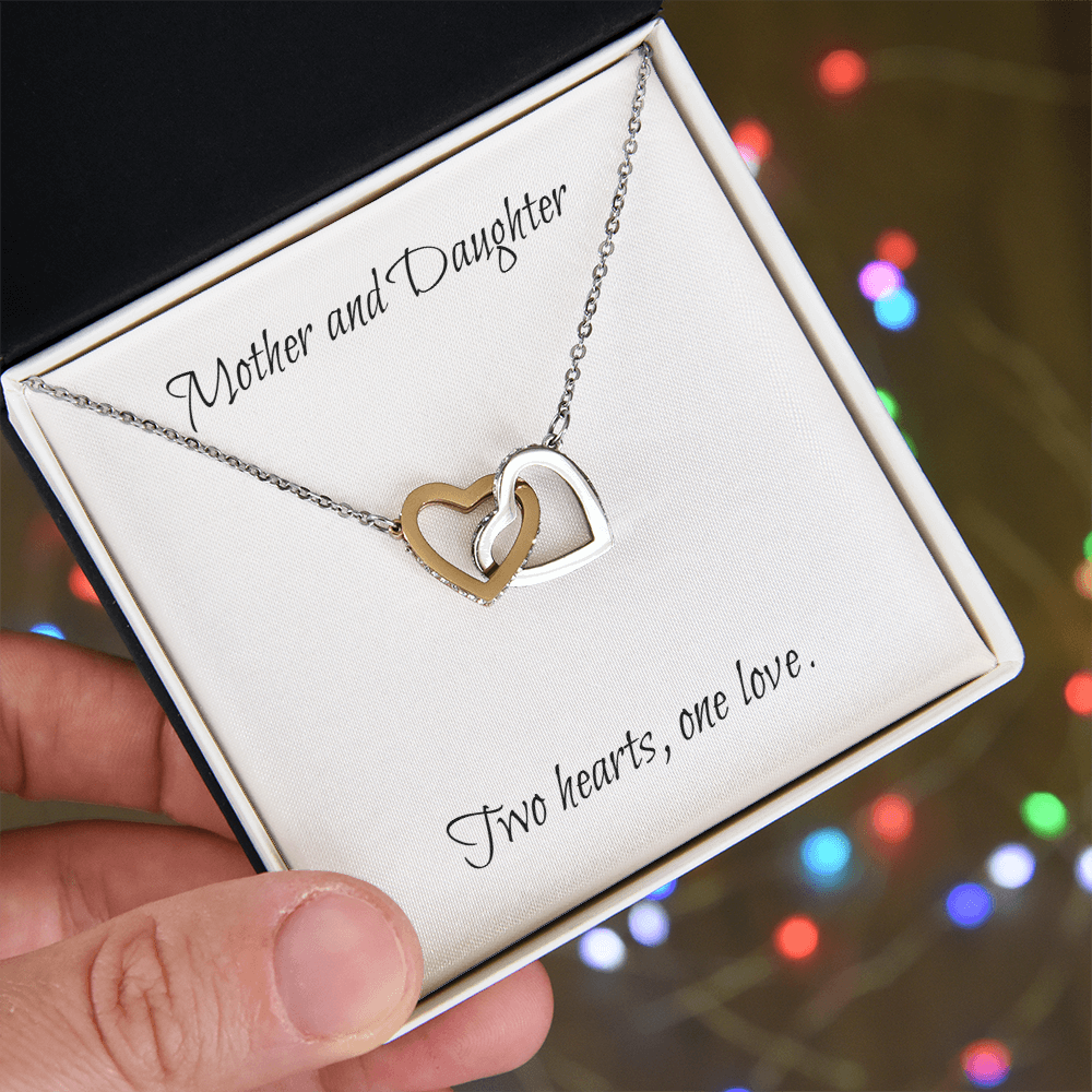 Mother and Daughter connecting hearts necklace.