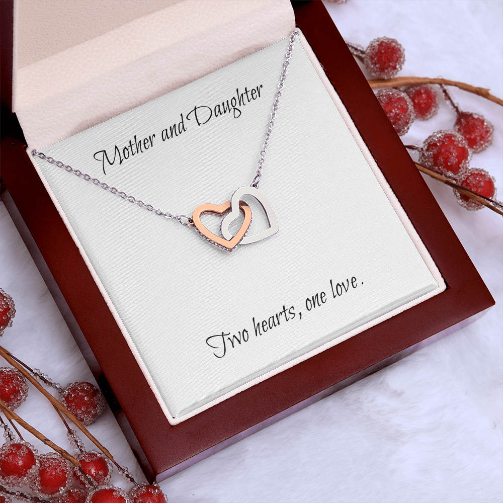Mother and Daughter connecting hearts necklace.