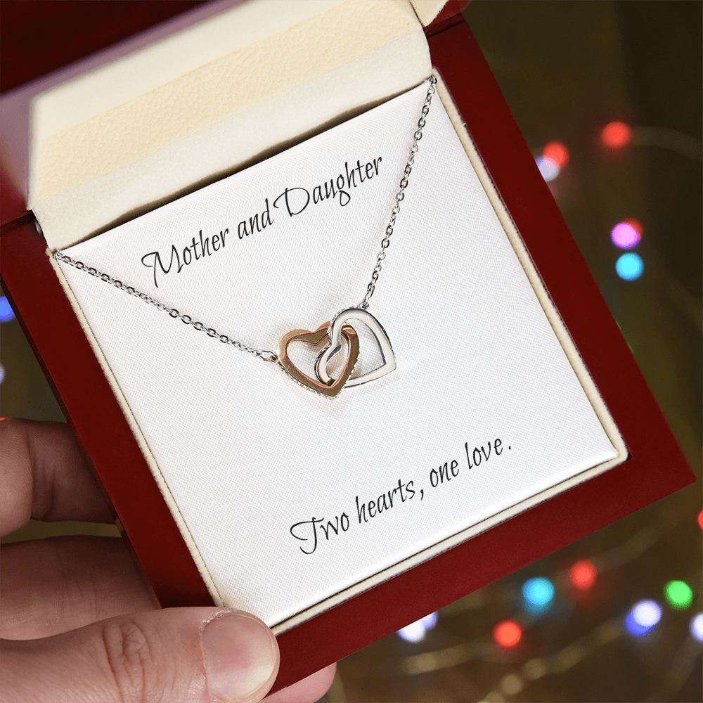 Mother and Daughter connecting hearts necklace.
